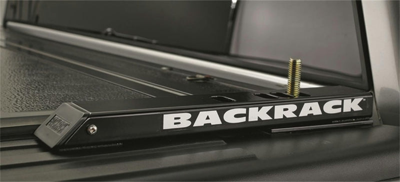 BackRack 2" Riser: black tonneau riser rail lettered BACKRACK on a truck bed rail over a tonneau cover