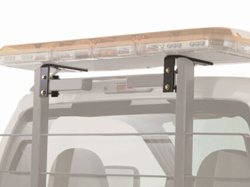 BackRack Light Brackets: pair of black light bar brackets on rack uprights holding an amber light bar, with the truck faded to gray