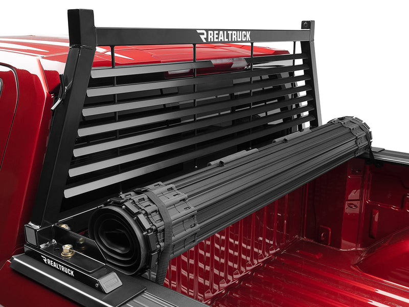 BackRack Louvered: A black louvered headache rack stands behind a rolled tonneau cover in a red pickup bed