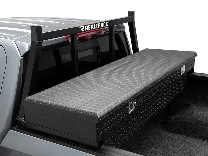 BackRack Open: black open headache rack mounted behind a silver pickup cab above a black diamond plate crossover toolbox