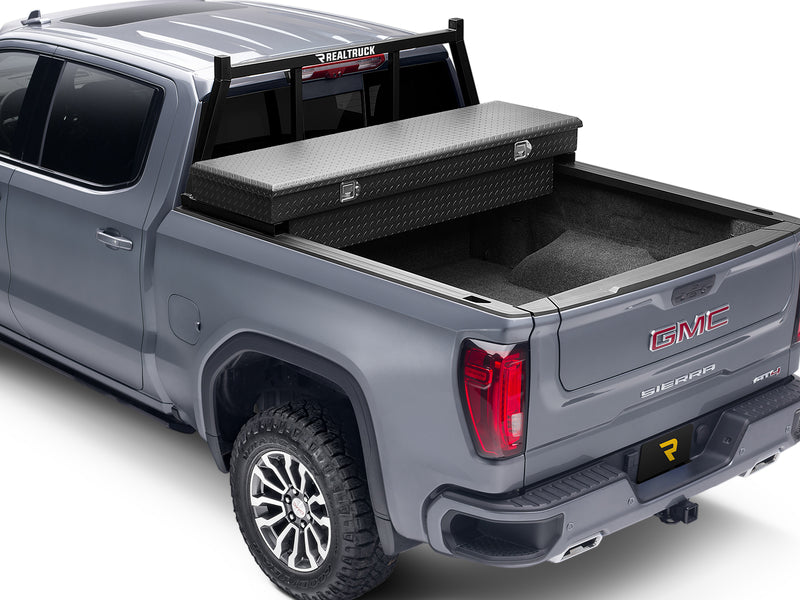 BackRack Open: gray pickup with a black open headache rack behind the cab and a black diamond plate crossover toolbox across the bed