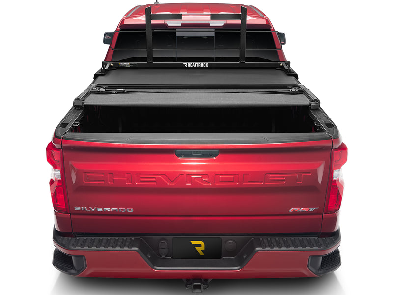 BackRack Original: rear view of a red pickup with a black Original headache rack and a folded black tonneau cover