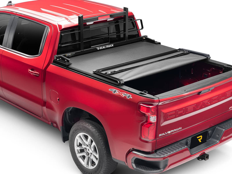 BackRack Original: red pickup with a black Original headache rack behind the cab and a partly folded black tonneau cover