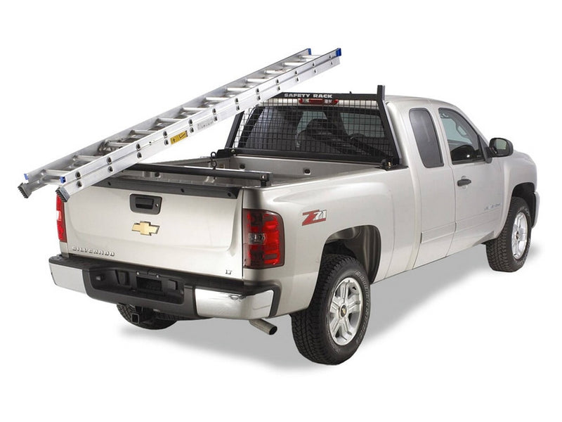 BackRack Rear Bar: silver pickup with an extension ladder resting on a black Safety headache rack and a rear ladder bar at the tailgate