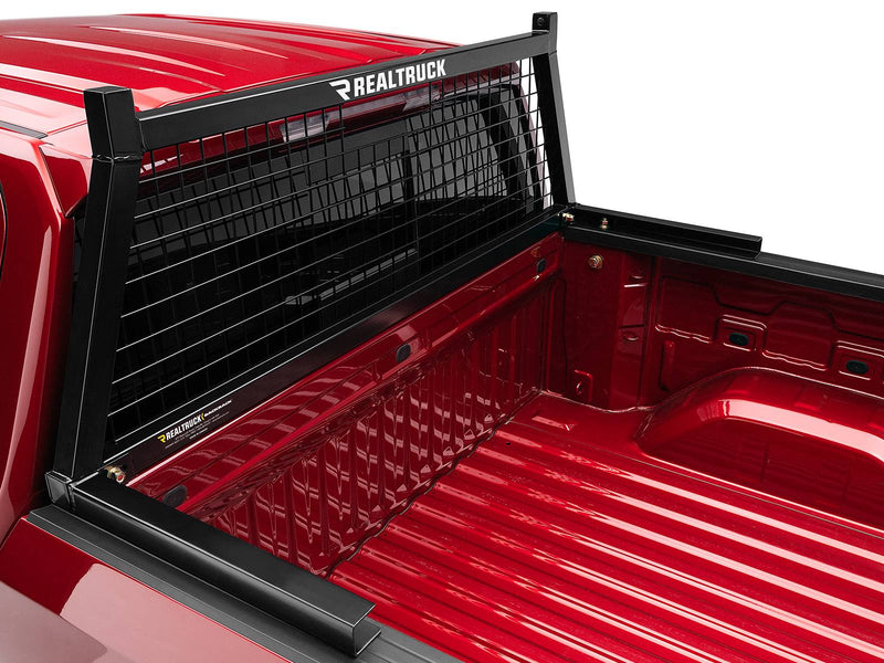 BackRack Safety: black Safety headache rack with mesh screen mounted at the front of a red pickup bed