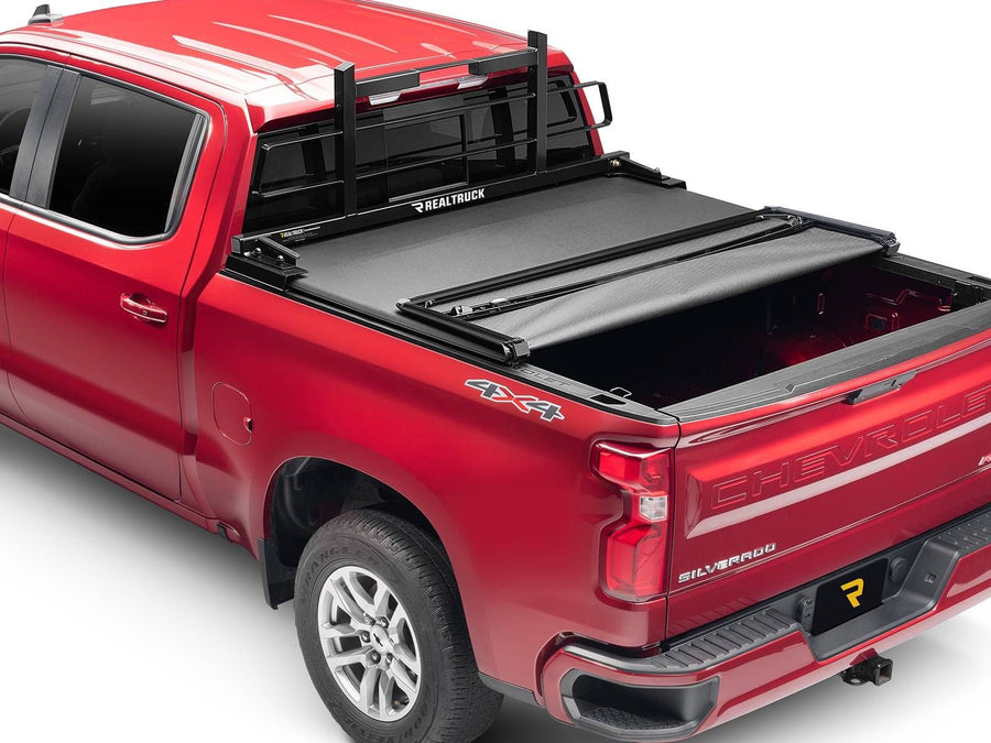 BackRack Original Headache Rack: Red pickup with a black Original headache rack behind the cab and a partly folded black tonneau cover.