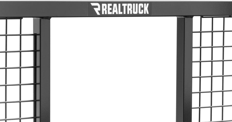 BackRack Half Safety Headache Rack: Close crop of the top bar of a black half safety rack with welded mesh panels and a RealTruck decal.