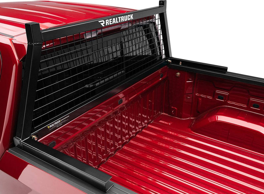 BackRack Safety Headache Rack: Black Safety headache rack with mesh screen mounted at the front of a red pickup bed.