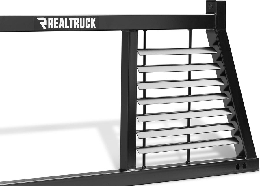 BackRack Half Louvered Headache Rack: Close crop of one louvered side of a black half louvered rack with a RealTruck decal on the top bar.