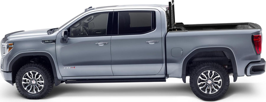 BackRack Utility Body Safety Rack: Side profile of a silver pickup crew cab with a black rack behind the cab.