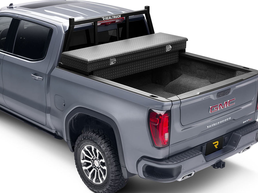 BackRack Open Headache Rack: Gray pickup with a black open headache rack behind the cab and a black diamond plate crossover toolbox across the bed.