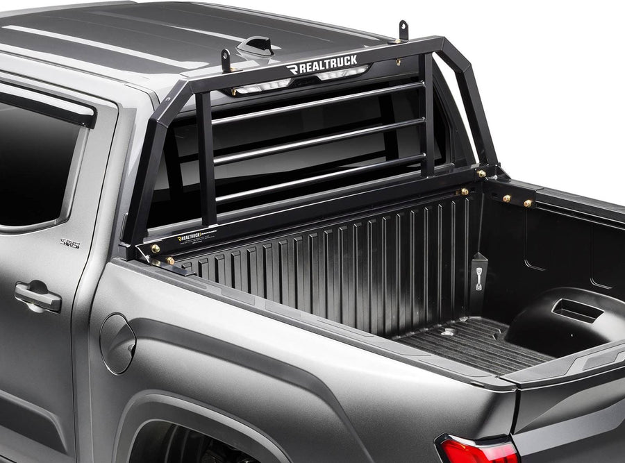 BackRack SR Headache Rack: Close three-quarter view of a black SR headache rack behind the cab of a gray pickup.