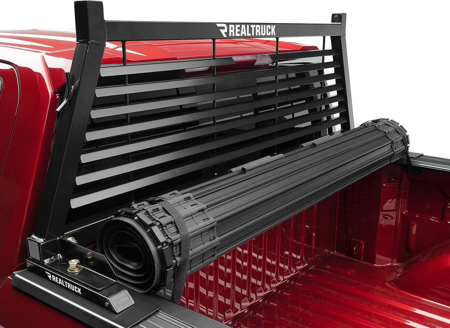 BackRack Louvered Headache Rack: A black louvered headache rack stands behind a rolled tonneau cover in a red pickup bed.