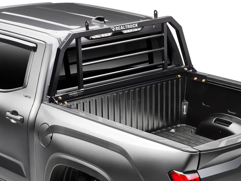 BackRack SR: close three-quarter view of a black SR headache rack behind the cab of a gray pickup
