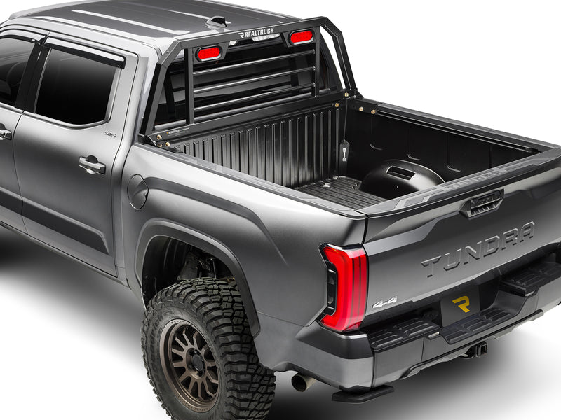 BackRack SRL: A gray Toyota Tundra seen from the rear quarter with a black headache rack and red lights mounted behind the cab