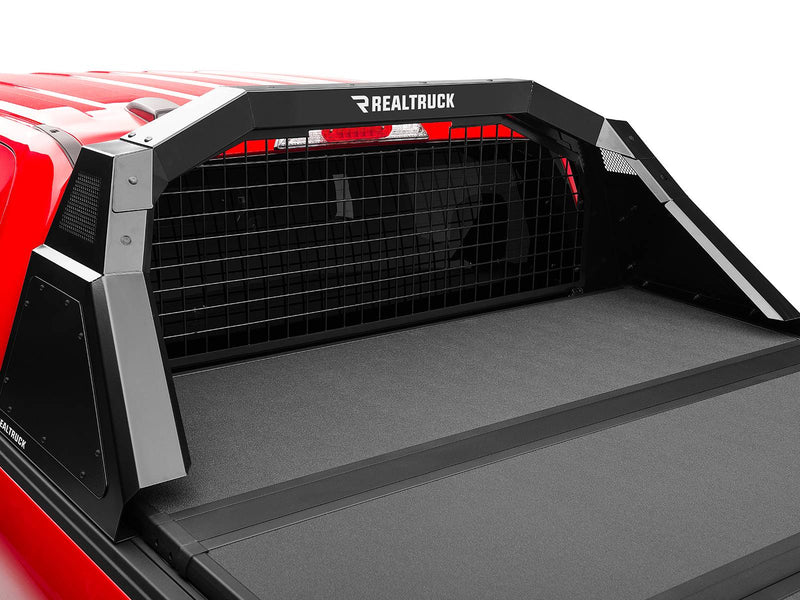 BackRack Trace Rack: A black Trace Rack with mesh screen behind the cab of a red pickup with a tonneau cover