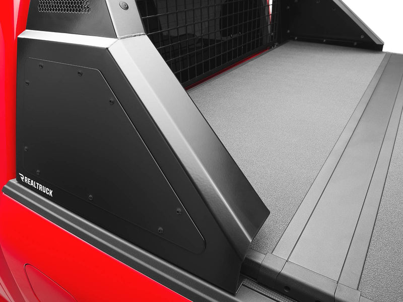 BackRack Trace Rack: close view of a black Trace Rack side box and mesh panel above a tonneau cover on a red pickup