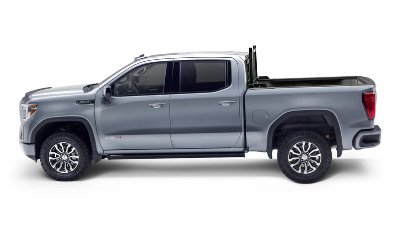 BackRack Utility Body Safety: side profile of a silver crew cab pickup with a black rack behind the cab