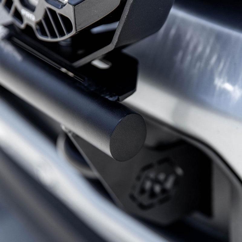 Close-up of the Baja Designs Bull Bar Light Kit: A close view of the black bull bar end tube and its mounting bracket on a silver truck