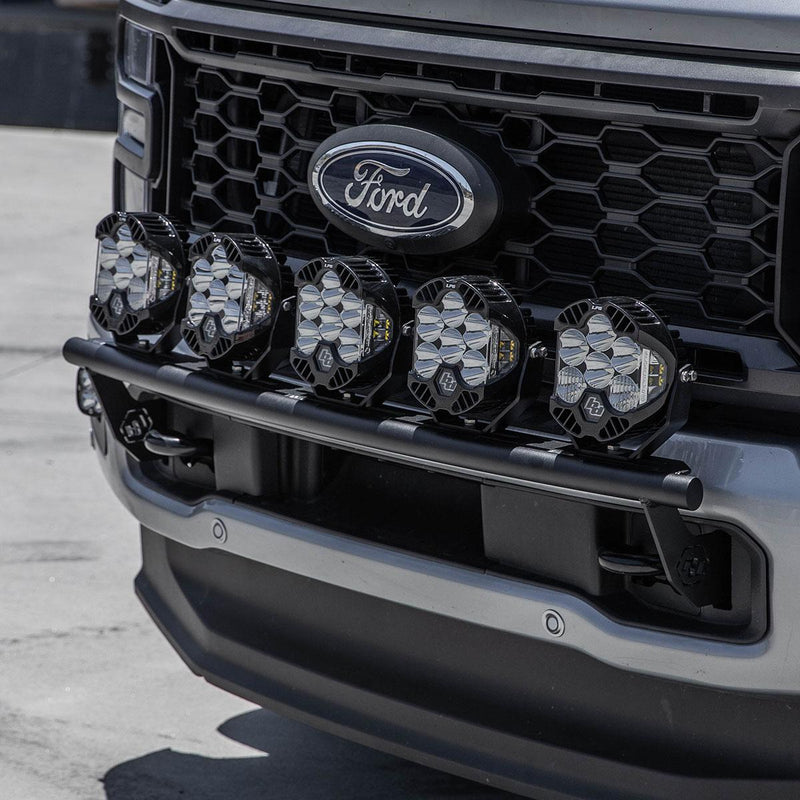 Baja Designs Bull Bar Light Kit on a Ford F-250/F-350 Super Duty: A row of LED pods on a black bull bar across the grille of a gray Ford truck
