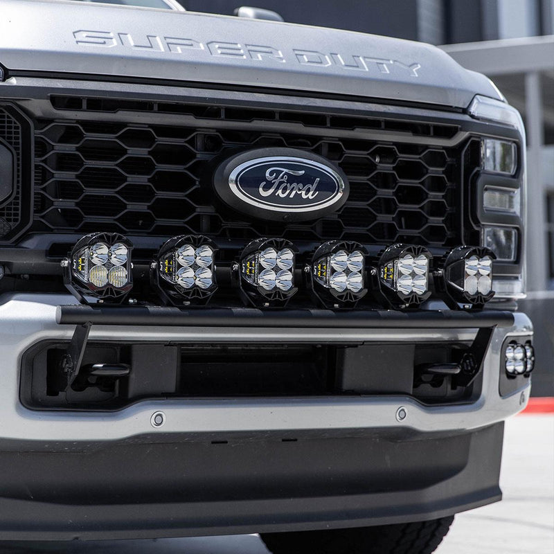 Baja Designs Bull Bar Light Kit on a Ford F-250/F-350 Super Duty: six LED pods on a black bull bar under the grille of a silver Ford Super Duty