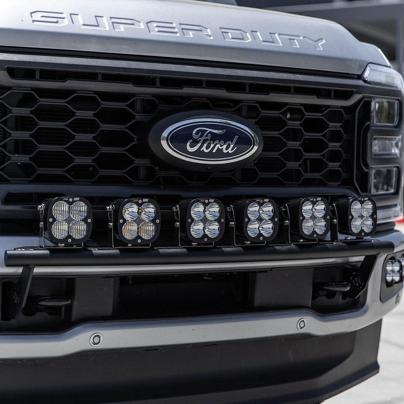 Baja Designs Bull Bar Light Kit on a Ford F-250/F-350 Super Duty: six square LED pods on a black bull bar under the grille of a silver Ford Super Duty