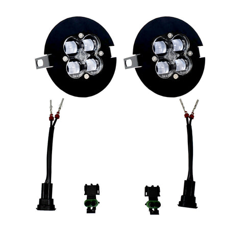 Baja Designs Ford/Toyota Squadron SAE Fog Pocket Light Kit, complete kit on a studio background: pair of round Squadron fog pods in black flat bezel plates with two pigtail harnesses and connectors, clear lenses laid out on a white background