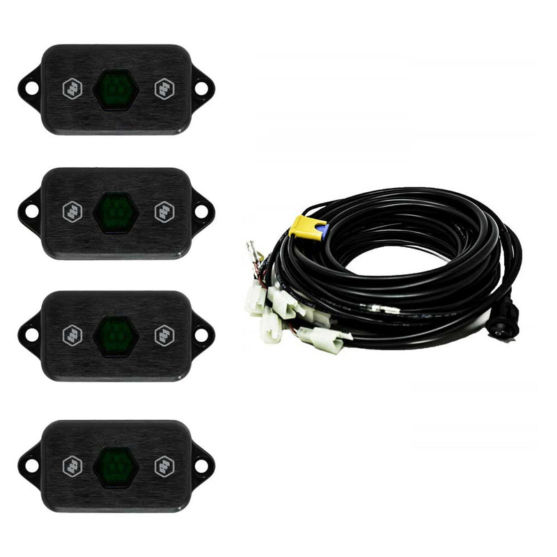 Baja Designs LED Rock Light Kit, complete kit on a studio background: four black LED rock light pods with green centers shown with a coiled multi-lead wiring harness on white