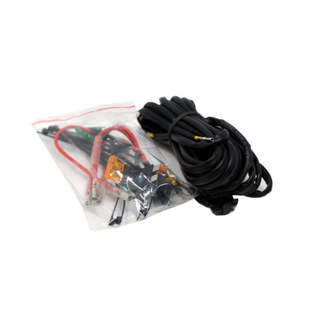 Baja Designs LP Series Backlit Add-on Wiring Harness, whole product on a studio background: coiled black backlight harness beside a clear bag of red leads and connectors on white