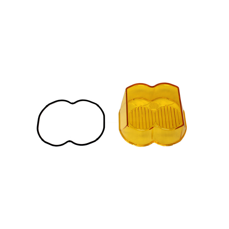 Baja Designs LP4 Light Pod Lens Kit, complete kit on a studio background: A amber LP4 replacement lens cover with fluted optics and a black rubber gasket on a white background; this SKU's frames show more than one lens color, so the color match is