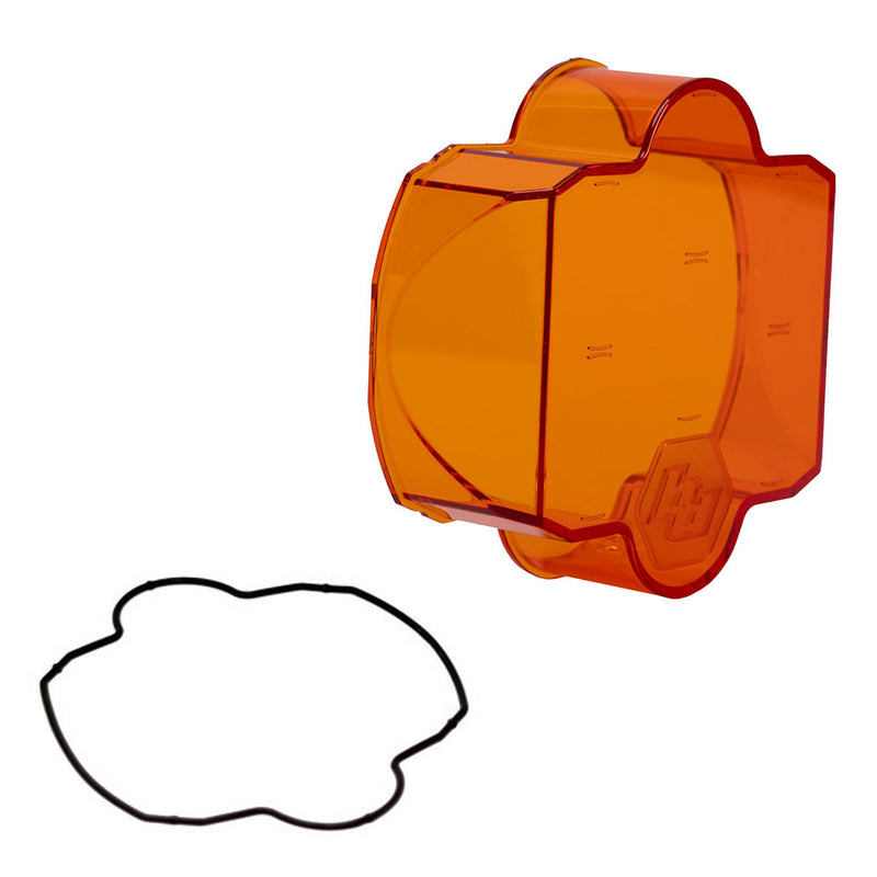 Baja Designs LP6 Light Pod Lens Kit, complete kit on a studio background: A orange LP6 replacement lens cover with smooth optics and a black rubber gasket on a white background