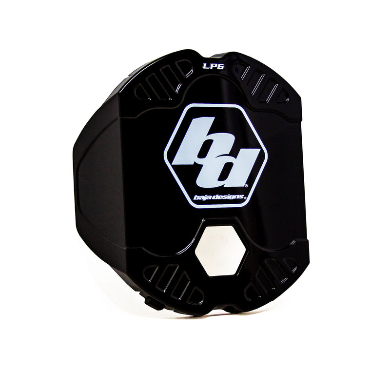 Baja Designs LP6 Single Rock Guard, whole product on a studio background: A black LP6 rock guard with a large white Baja Designs logo and a hex center opening on a white background