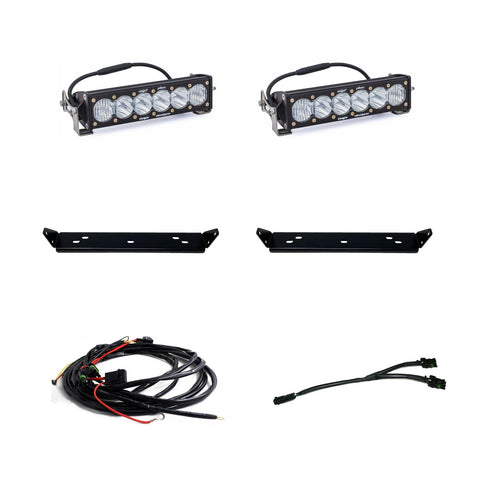 Baja Designs OnX6+ 10" Dual Behind Grille Light Bar Kit, complete kit on a studio background: two 10" OnX6+ LED light bars with clear lenses, two black mounting plates, a wiring harness and a splitter cable on white