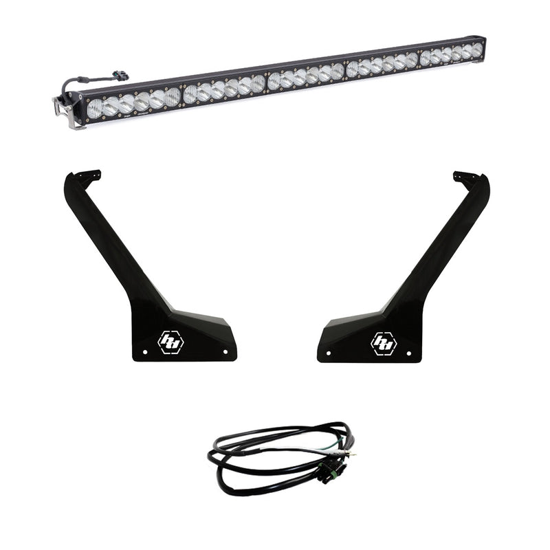 Baja Designs OnX6+ 50" Roof Mount Light Kit, complete kit on a studio background: A long LED light bar shown above two black Jeep A-pillar roof brackets and a coiled wiring harness on white