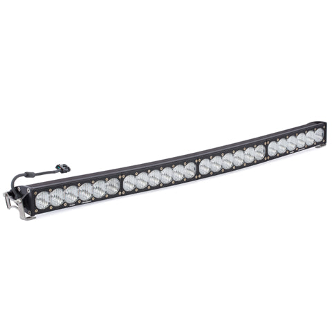 Baja Designs OnX6+ Arc LED Light Bar, whole product on a studio background: curved black OnX6 Arc LED light bar with clear optics, end mounts and a wiring pigtail on a white background