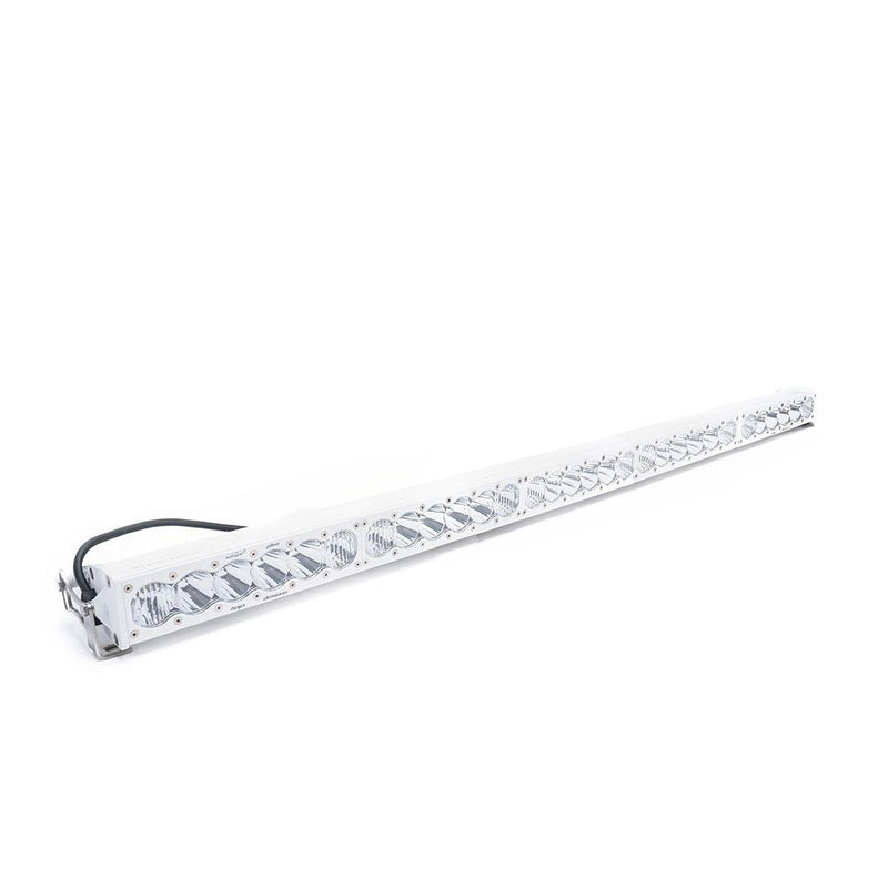 Baja Designs OnX6+ White Straight LED Light Bar, whole product on a studio background: long white LED light bar with clear lenses and a wiring harness on a white background