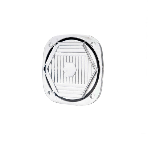 Baja Designs S1 Light Pod Lens Kit, complete kit on a studio background: A small clear S1 pod lens with a hexagon optic pattern and a seated black gasket on a white background
