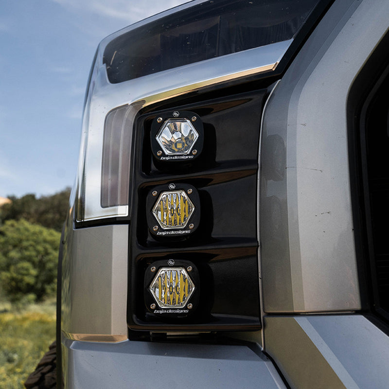 Baja Designs S1 Vent Kit on a Toyota Tundra: three small Baja Designs S1 pods sit stacked in the front bumper vent of a silver pickup