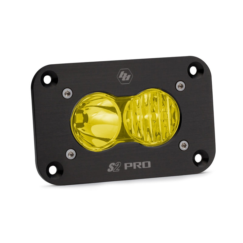 Baja Designs S2 Pro Black Flush Mount LED Auxiliary Light Pod, whole product on a studio background: A black S2 Pro flush mount LED pod with an amber driving combo lens and a flat mounting flange