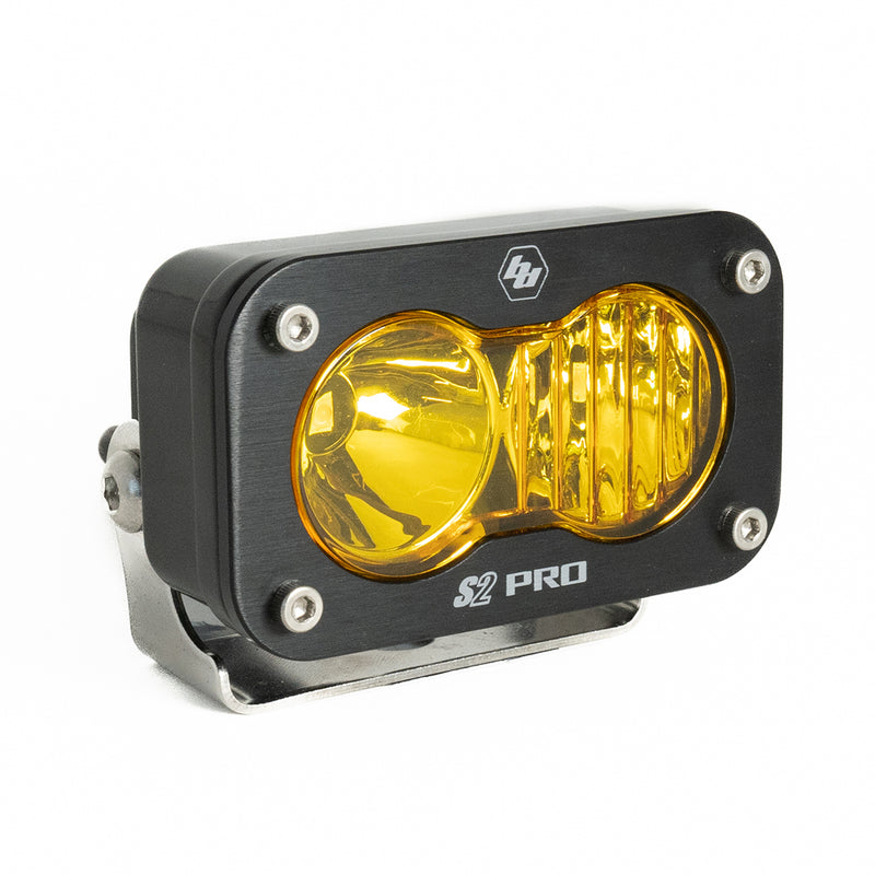 Baja Designs S2 Pro Black LED Auxiliary Light Pod, whole product on a studio background: A black S2 Pro LED pod with an amber driving combo lens on a stainless bracket