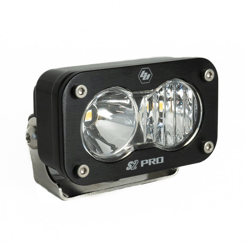 Baja Designs S2 Pro Black LED Auxiliary Light Pod, whole product on a studio background: A black S2 Pro LED pod with a clear driving combo lens on a stainless bracket
