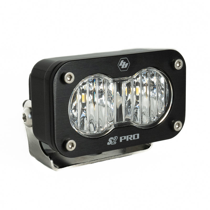 Baja Designs S2 Pro Black LED Auxiliary Light Pod, whole product on a studio background: A black S2 Pro LED pod with a clear fluted wide cornering lens on a stainless bracket