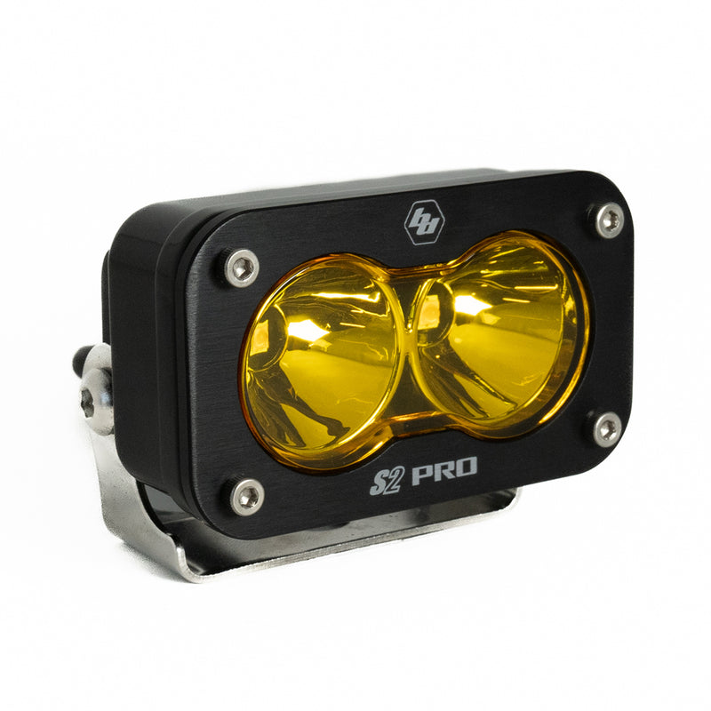 Baja Designs S2 Pro Black LED Auxiliary Light Pod, whole product on a studio background: A black S2 Pro LED pod with an amber spot lens on a stainless bracket