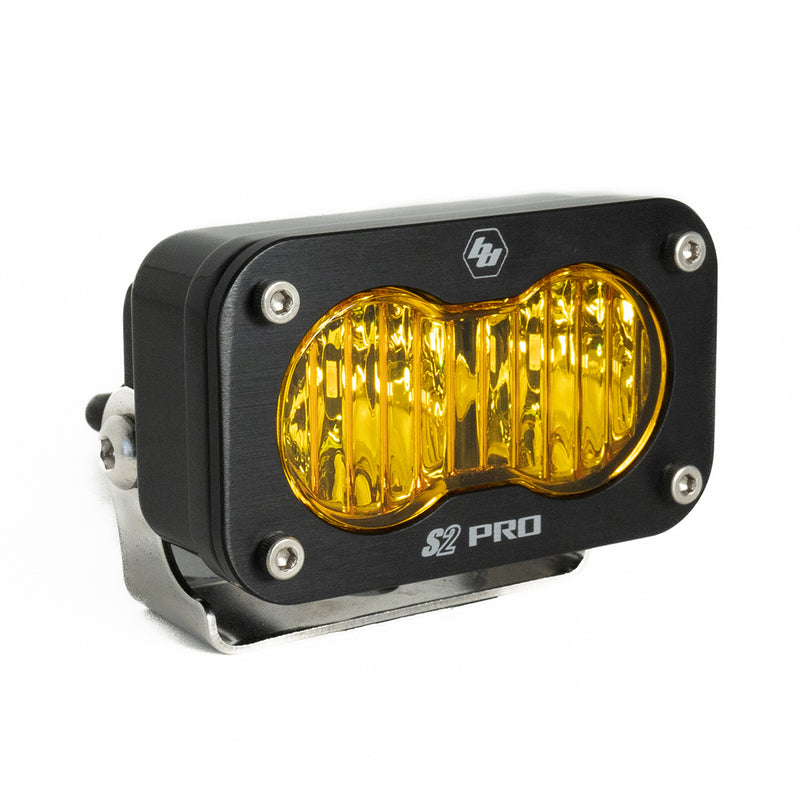 Baja Designs S2 Pro Black LED Auxiliary Light Pod, whole product on a studio background: A black S2 Pro LED pod with an amber fluted wide cornering lens on a stainless bracket