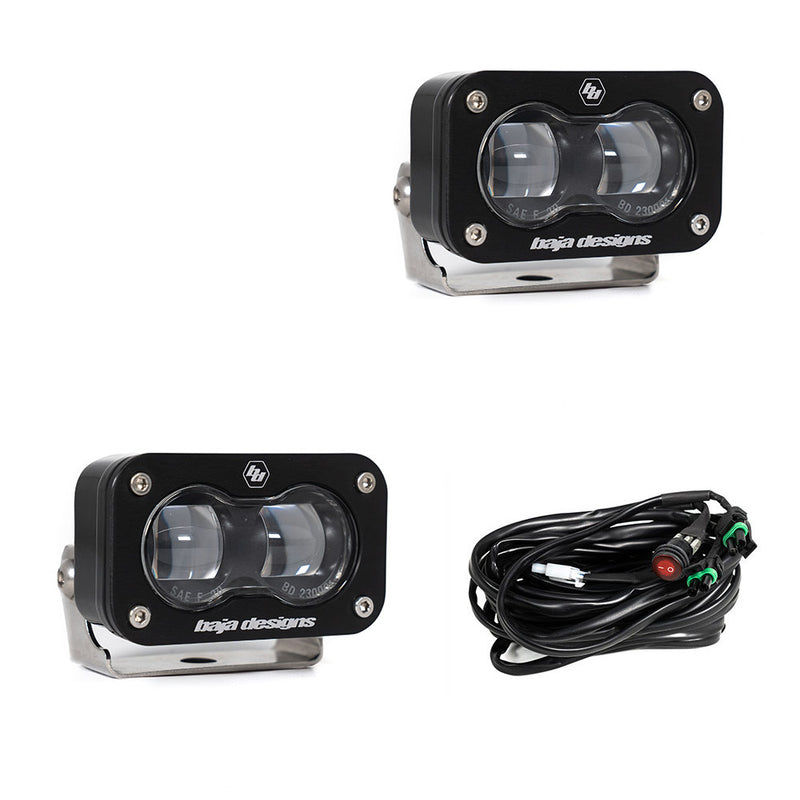Baja Designs S2 SAE LED Auxiliary Light Pod Pair, whole product on a studio background: two black S2 SAE LED pods with clear projector lenses and a wiring harness with switch on a white background