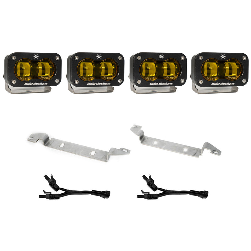 Baja Designs S2 SAE OEM Fog Light Replacement Kit, complete kit on a studio background: four black S2 SAE fog pods with amber lenses, two silver bumper brackets and two Y harnesses on white
