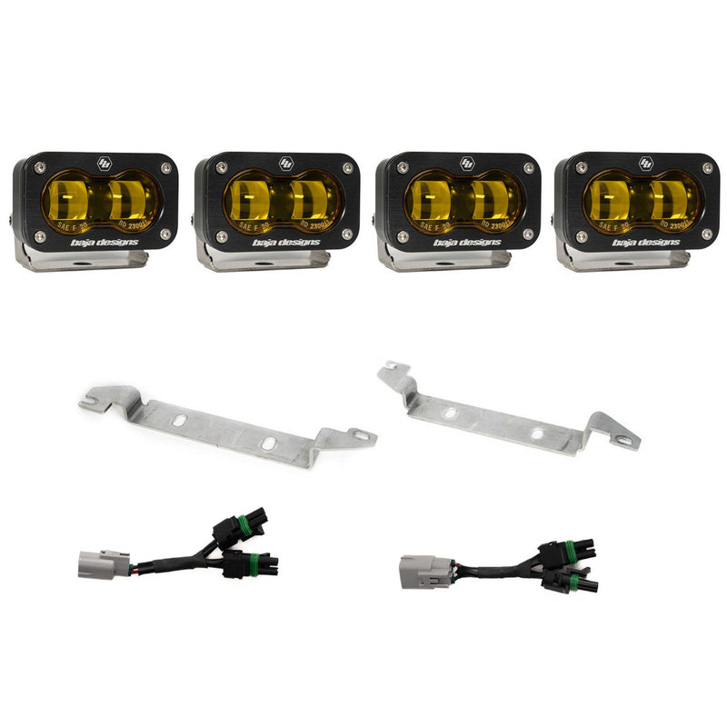 Baja Designs S2 SAE OEM Fog Light Replacement Kit, complete kit on a studio background: four black S2 SAE fog pods with amber lenses, two silver bumper brackets and two Y harnesses with gray factory plugs on white