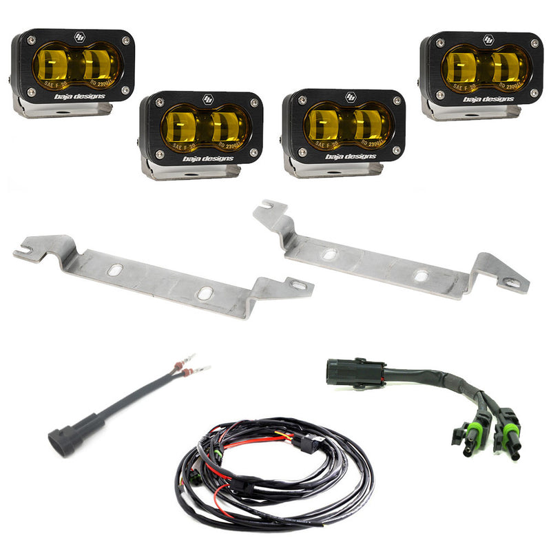 Baja Designs S2 SAE OEM Fog Light Replacement Kit, complete kit on a studio background: four black S2 SAE pods with amber lenses, two steel mounting brackets, harness adapters and a wiring harness on white