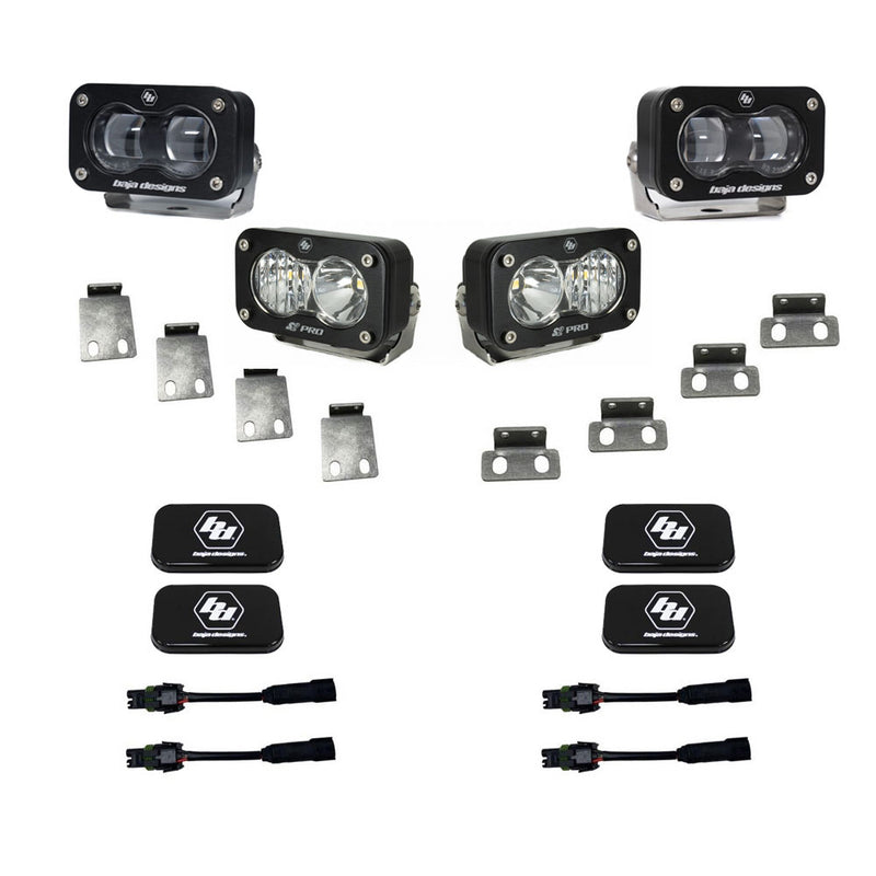 Baja Designs S2 SAE/S2 Pro Fog Pocket Kit, complete kit on a studio background: four clear-lens S2 pods with mounting tabs, black Baja Designs covers and adapter harnesses arranged on white