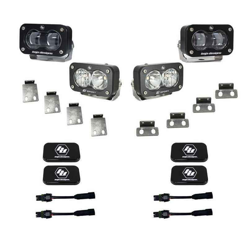 Baja Designs S2 SAE/S2 Sport Fog Pocket Kit, complete kit on a studio background: two S2 SAE and two S2 Sport pods with clear lenses, steel mounting tabs, black covers and adapter harnesses on white